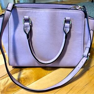 Accessorize purple handbag with removable strap